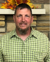 Casey Ash Service Department Casey Ash Service Department, man with brown hair wearing a green plaid shirt