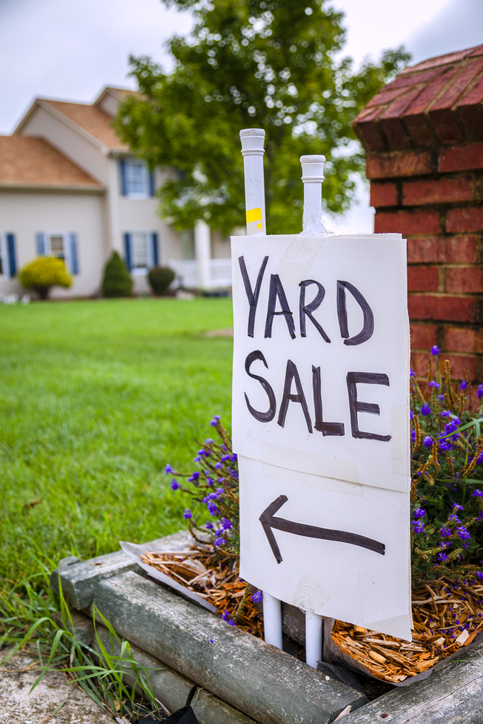 Hand-lettered Yard Sale sign in a Pleasantville front yard