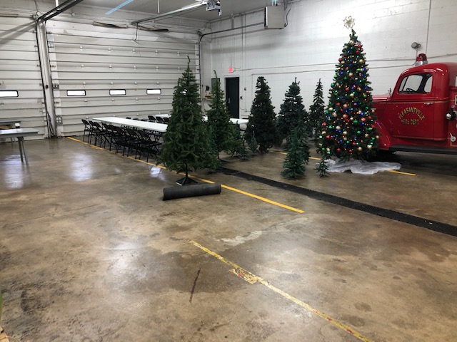 decorated christmas trees in a garage